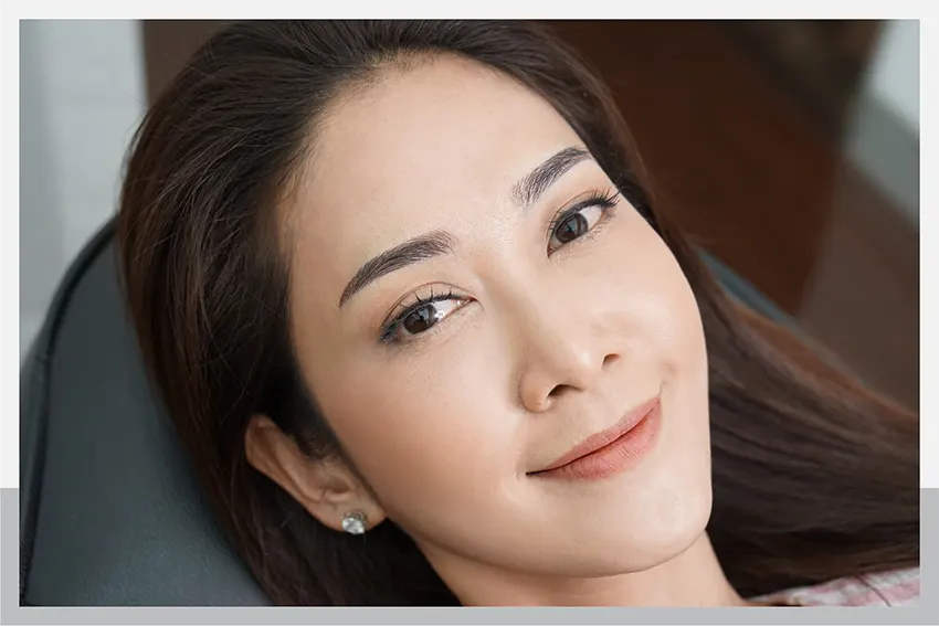 Why do you have to do your eyebrow painting at Adenaa while sitting with your back straight?